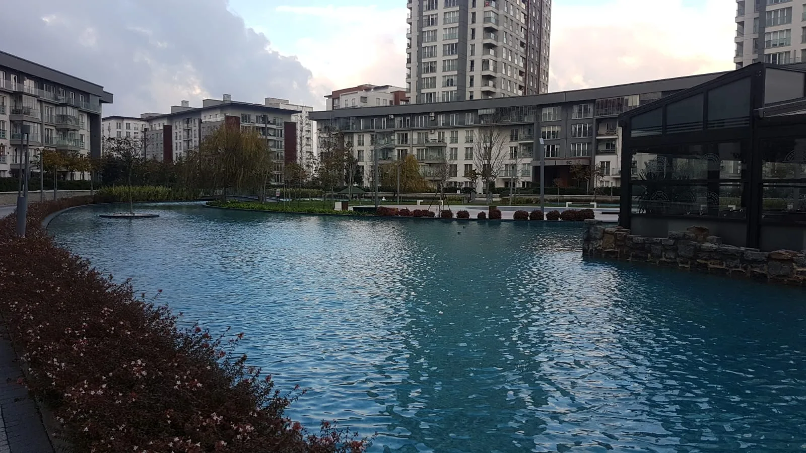 Real photo of TEMA Bahce as viewed from the landscape level, looking across the artificial lake
