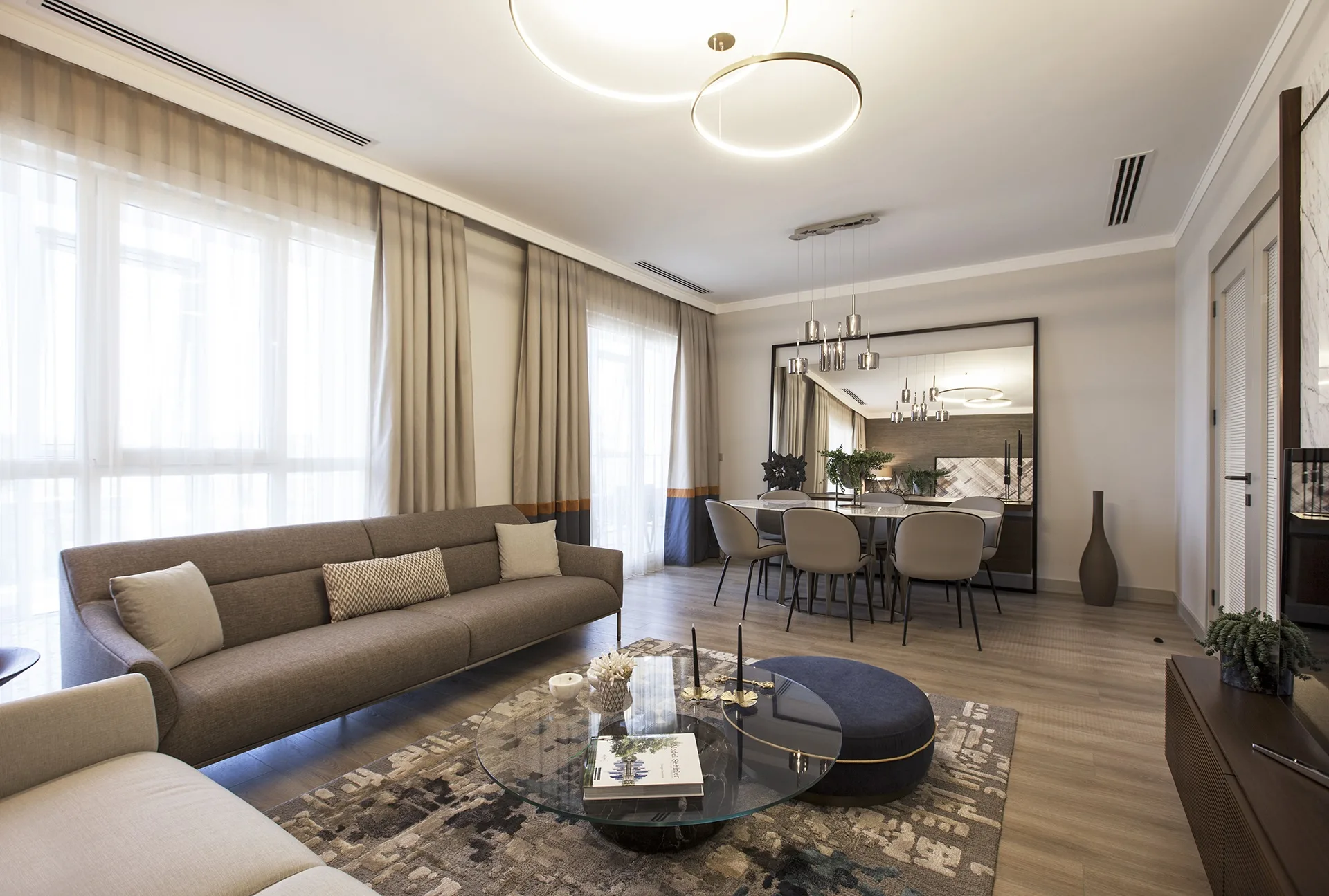 Living room view of an apartment at the TEMA Bahce complex