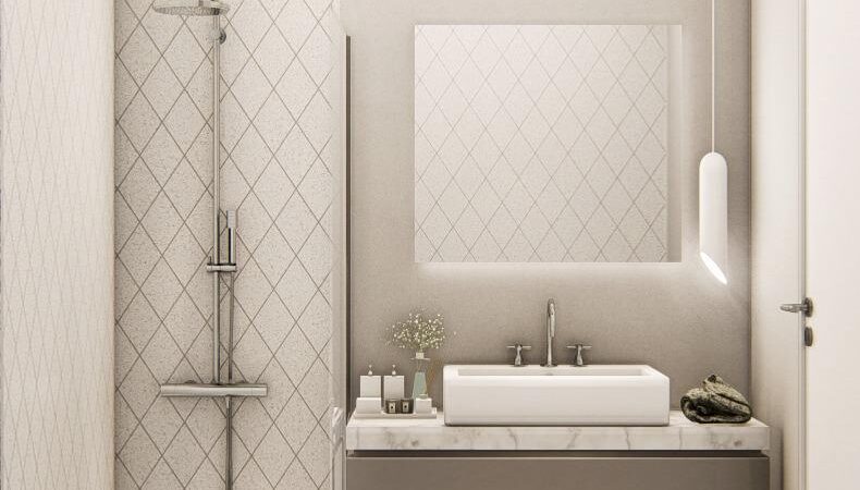 Bathroom showing the sink unit and shower, with a mirror. Walls decorated in neutral colours.