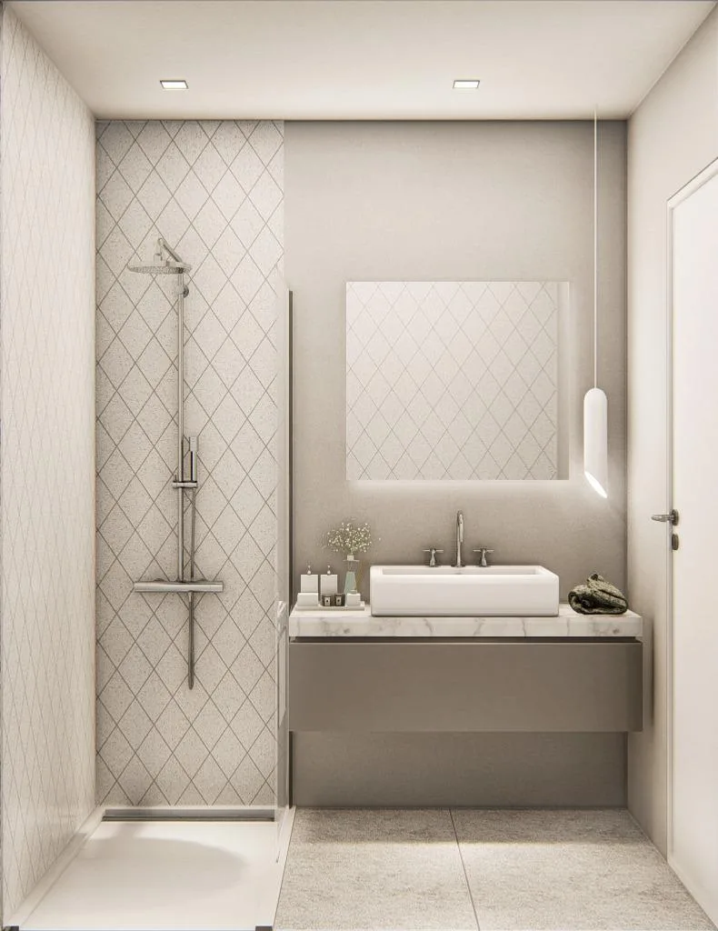 Bathroom showing the sink unit and shower, with a mirror. Walls decorated in neutral colours.