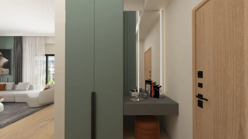 Image of an entree cupboard to an apartment with mirror and double door cupboard