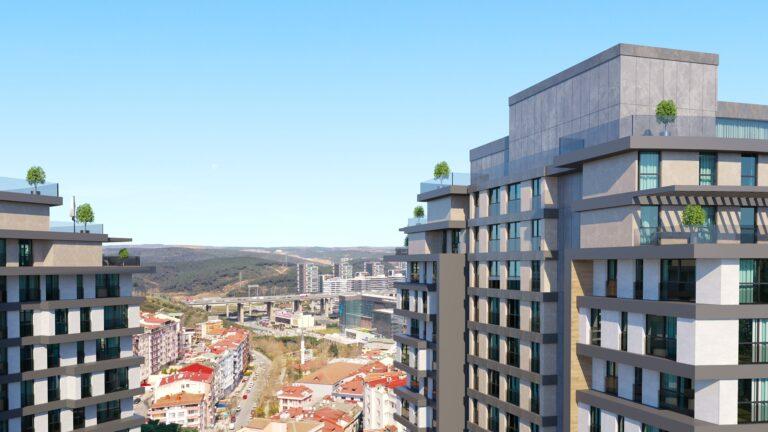 View of the upper floors of a dual tower apartment project showing the forest views