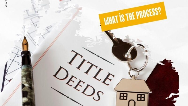 Image of a title deed, a fountain pen, and a set of house keys.