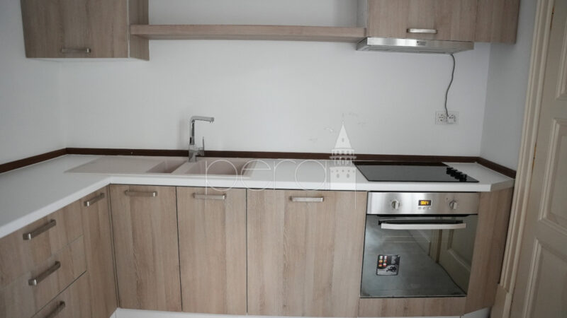 A view of the kitchen showing the sink and oven