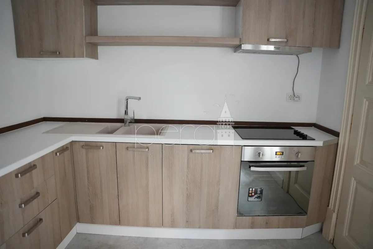 A view of the kitchen showing the sink and oven